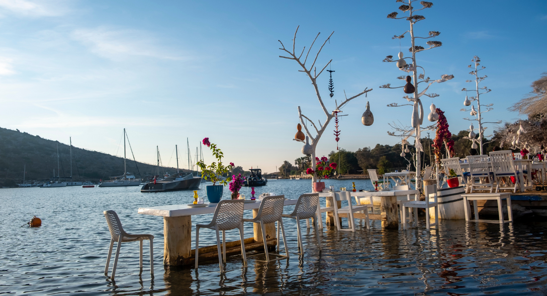 Yachts & restaurants on the Aegean coast in Gumusluk, Bodrum in Turkey